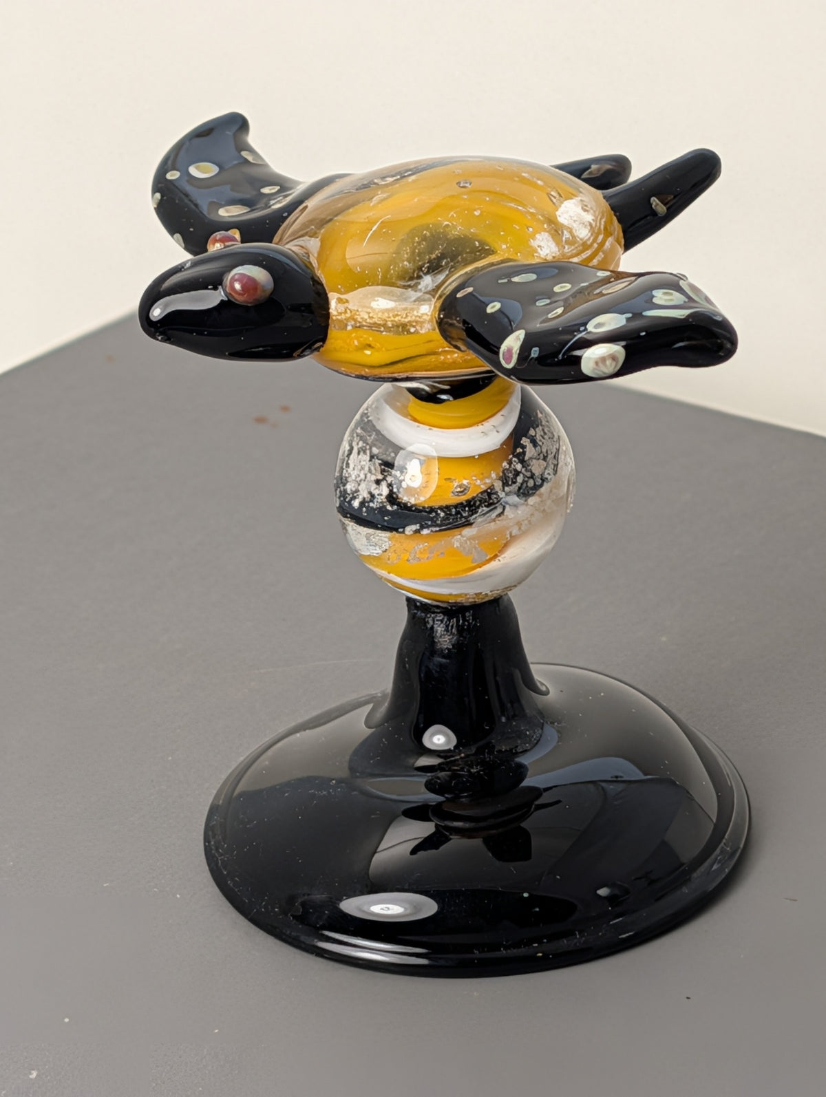Side view of Glass Everlasting gold and black turtle Legacy Goblet memorial glass sculpture